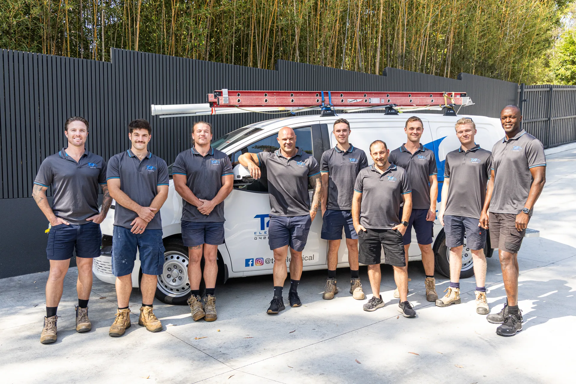 The Family Electrician Ashmore team with a service van